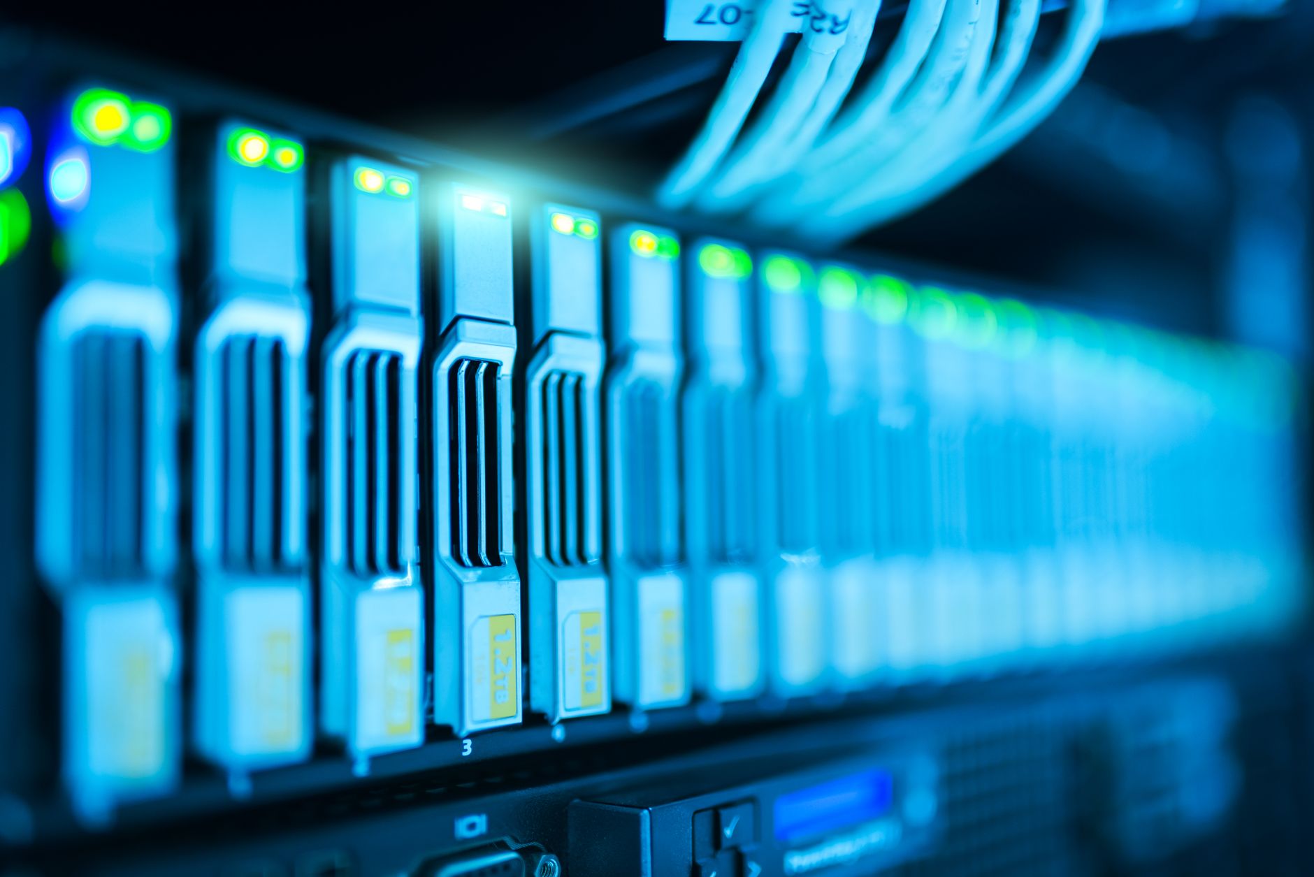 A close-up of a high-end server rack with glowing fiber optic cables, superimposed with a faint, translucent outline of a digital fantasy landscape.