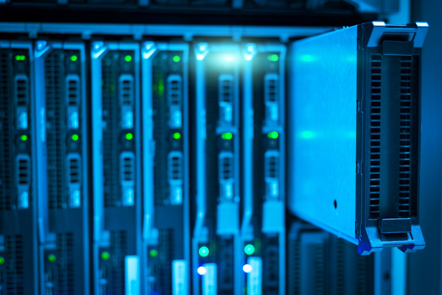 A massive server room with glowing green and blue lights, resembling a futuristic data center with high-end GPUs.