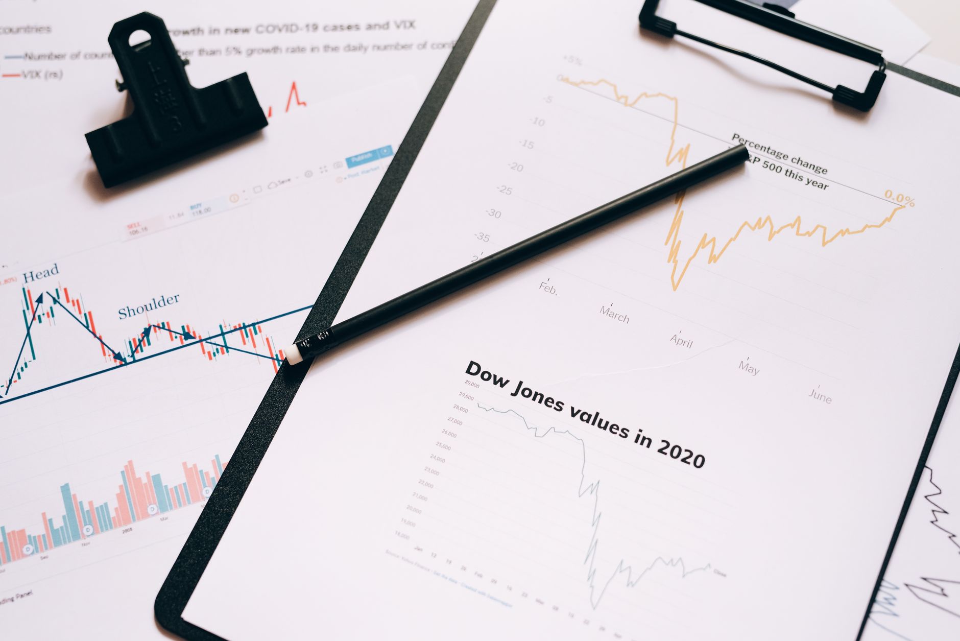 A conceptual editorial illustration of legal documents bundled with financial ticker tape.