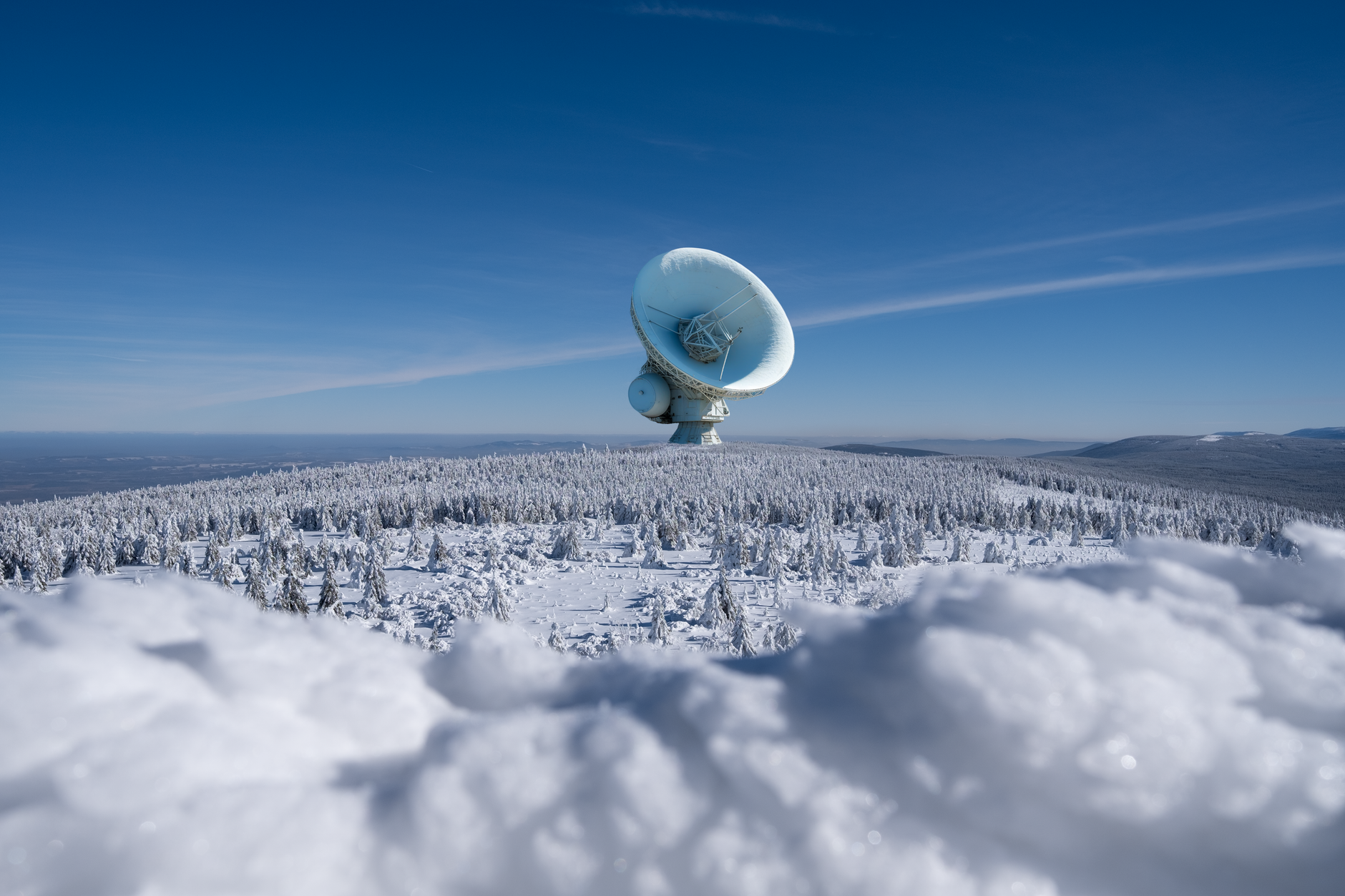 A glowing server rack floating in orbit above Earth.